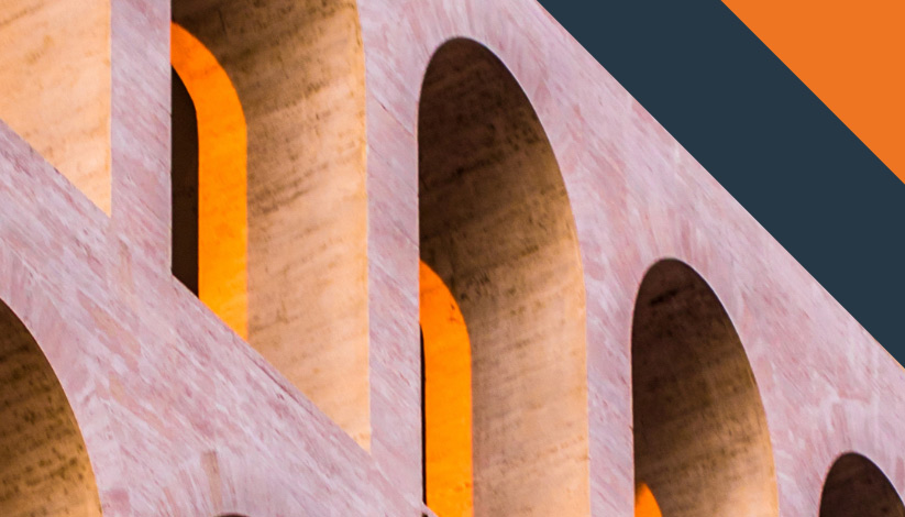 Brick wall lined with arched windows