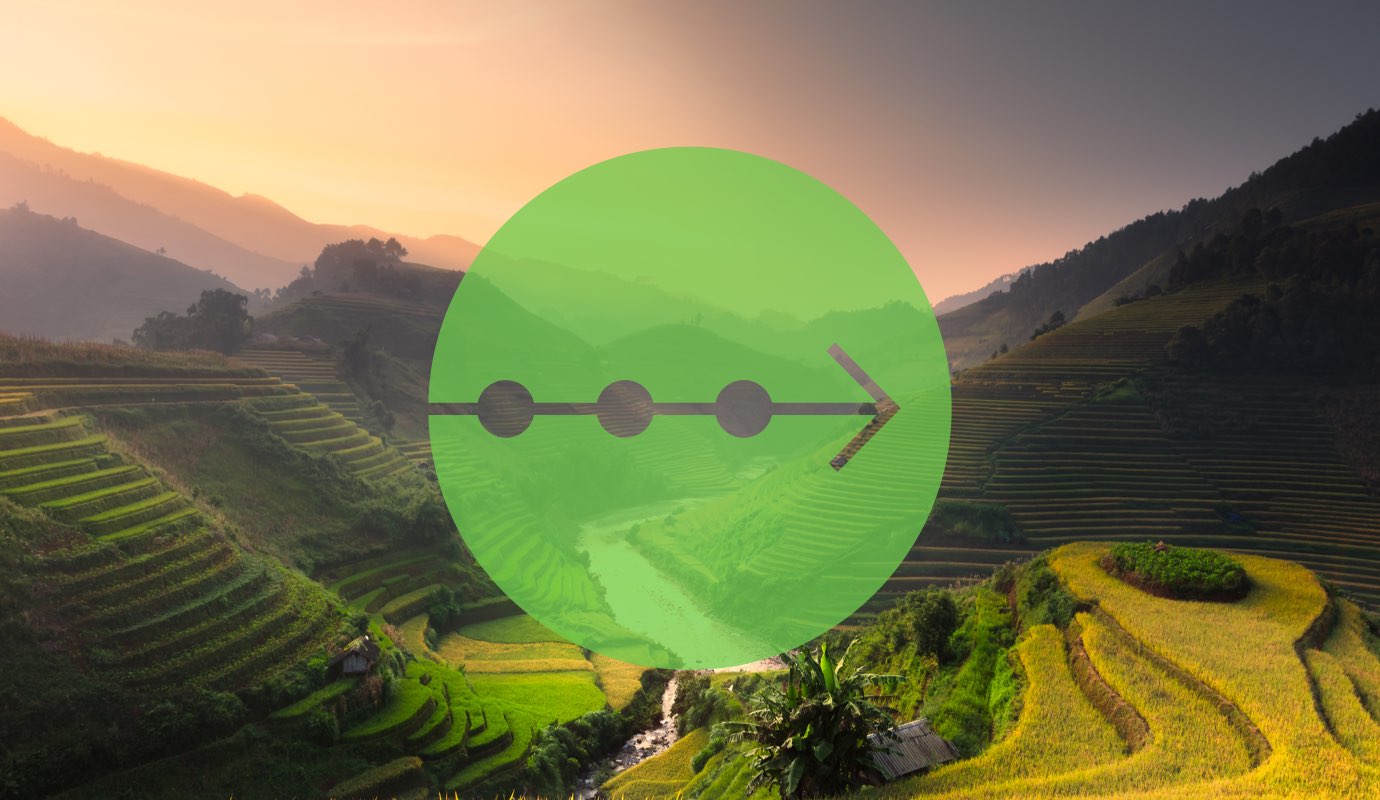 A timeline icon over a photo of farming hills